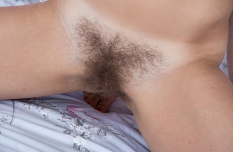 Amateur model Anna Smith removes white lingerie and nylons to bare hairy twat