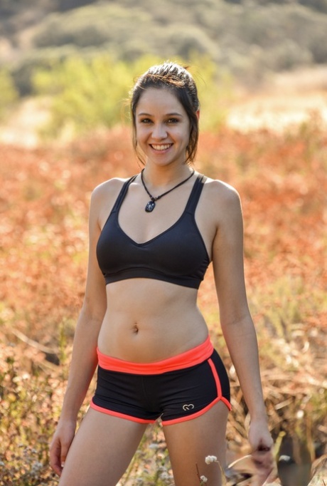 Cute teen girl toys her twat until she pees and flashes in nature setting too