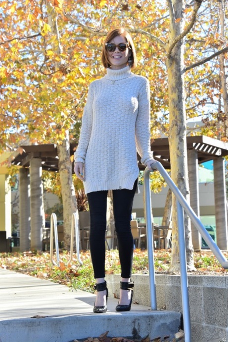 Young redhead flashes her tits and pulls down her jeans on campus sidewalk