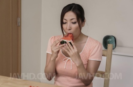 Japanese MILF Mirei Yokoyama eats watermelon before licking a cock