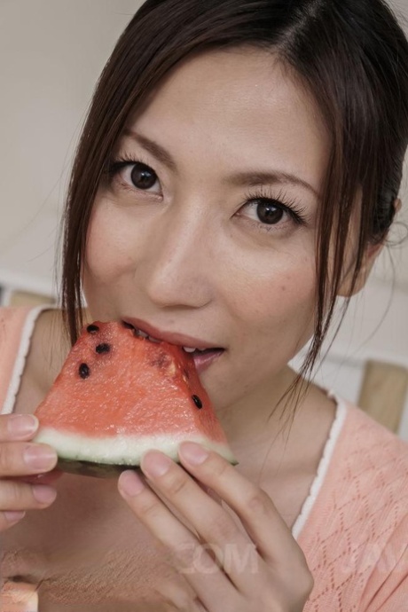Japanese MILF Mirei Yokoyama eats watermelon before licking a cock