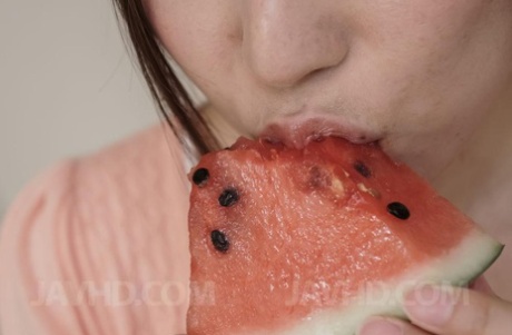 Japanese MILF Mirei Yokoyama eats watermelon before licking a cock