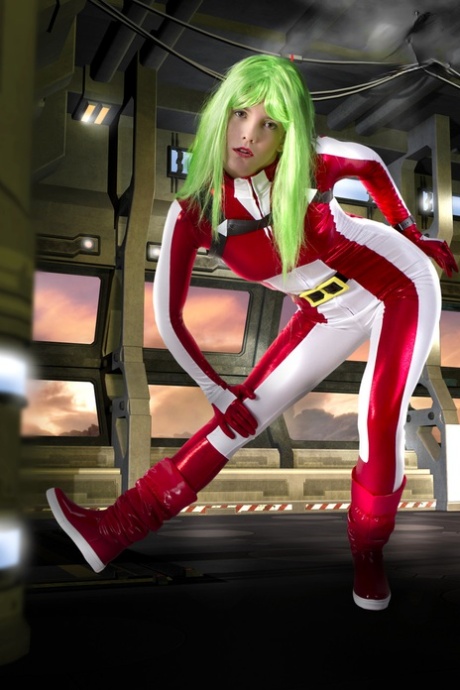 Cosplayer sports green hair while releasing her perky tits from her outfit