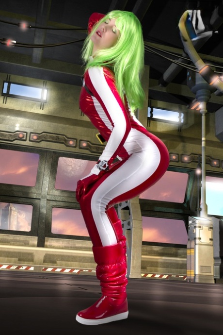Cosplayer sports green hair while releasing her perky tits from her outfit
