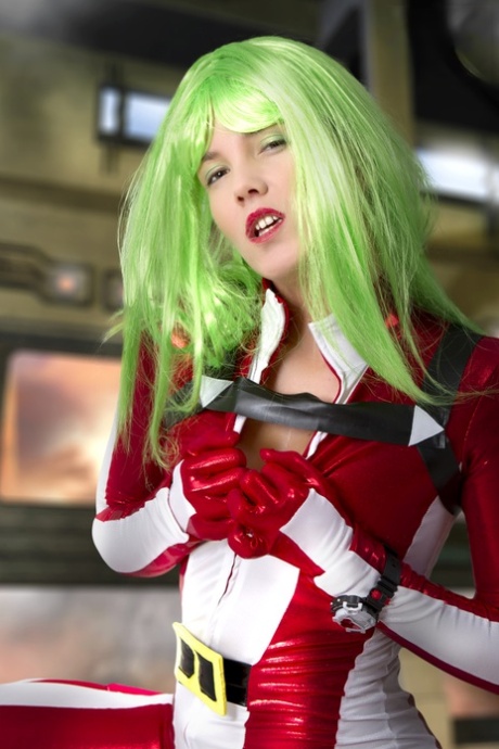 Cosplayer sports green hair while releasing her perky tits from her outfit