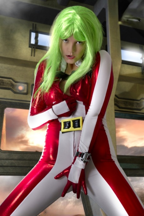 Cosplayer sports green hair while releasing her perky tits from her outfit