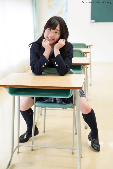 Sweet Japanese schoolgirl pulls down panties showing bare ass in the library