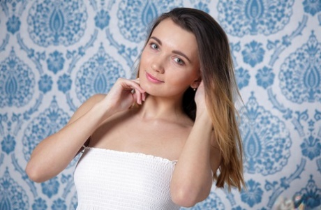 Pretty Aria Bella in lace dress gets naked on her knees to show closeup muff