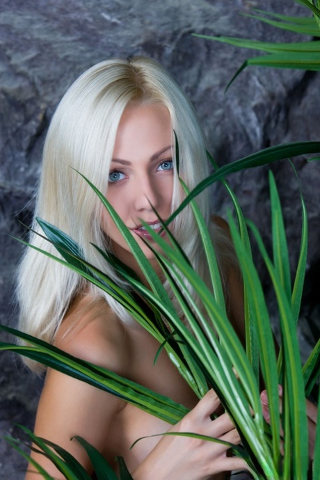 Blue-eyed blonde Lija touts her nice ass and snatch while naked on a beach