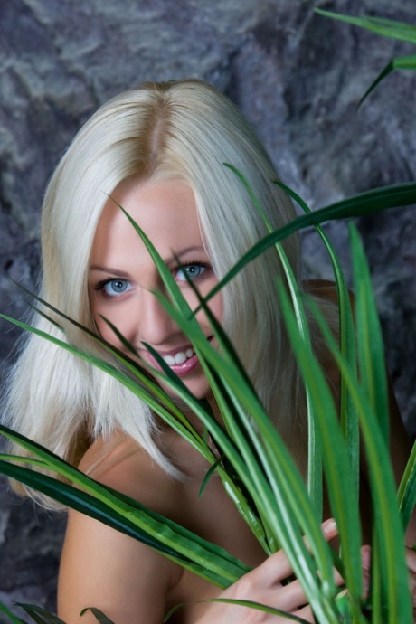Blue-eyed blonde Lija touts her nice ass and snatch while naked on a beach