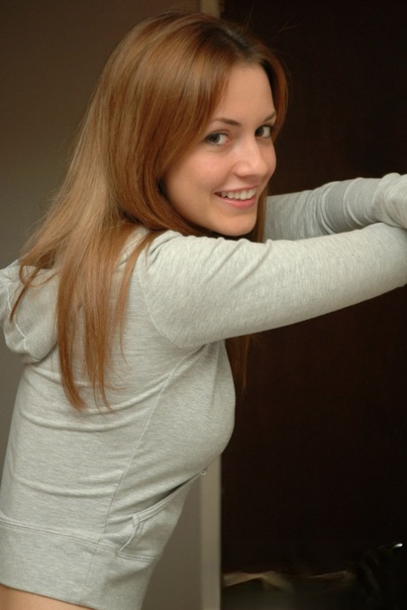 Amateur model with a pretty face poses non nude in denim jeans