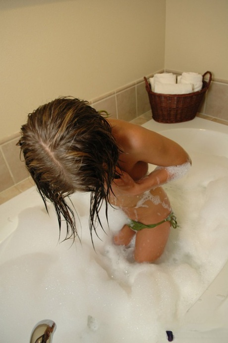 Flat chested Diddylicious sheds her bikini in the bath showing soapy hot ass