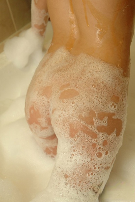 Flat chested Diddylicious sheds her bikini in the bath showing soapy hot ass