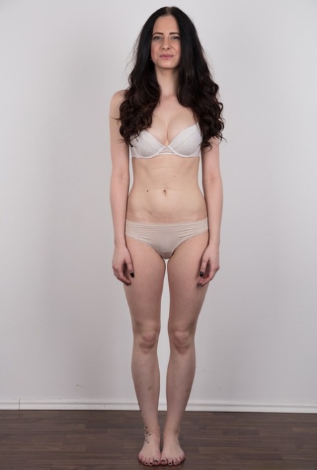 Dark haired female with a firm face model in the nude for the first time
