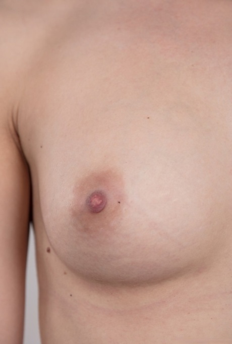 Dark haired female with a firm face model in the nude for the first time