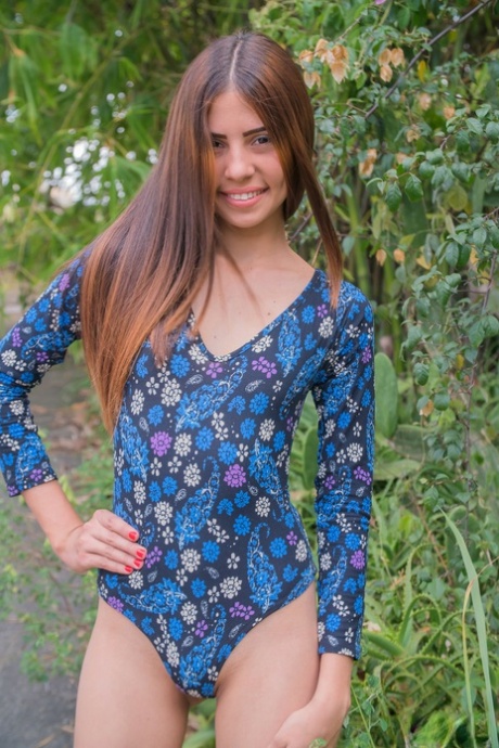 Skinny teen Mily Mendoza bends over naked outdoors to show a perfect tiny ass