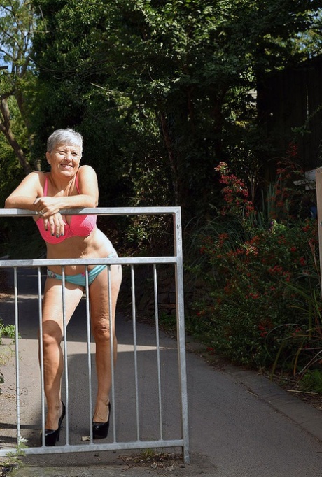Brazen hot mature granny Savana poses outdoors in her sexy lingerie