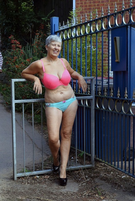 Brazen hot mature granny Savana poses outdoors in her sexy lingerie