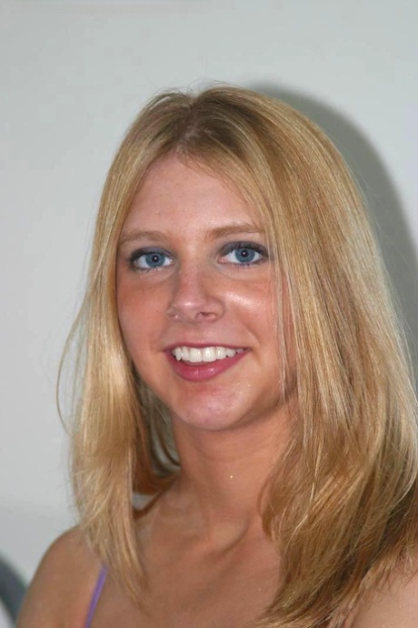 Blonde amateur Nicole removes mauve lingerie and socks before showing her twat