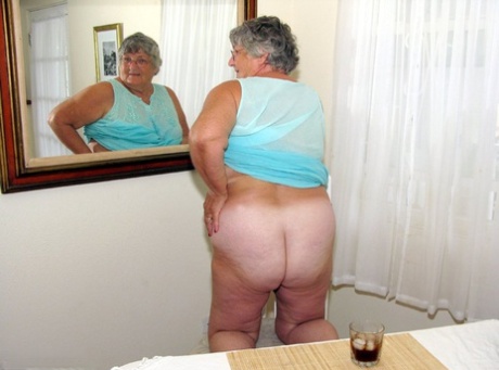 Obese amateur Grandma Libby bares her tan lined body after a phone sex