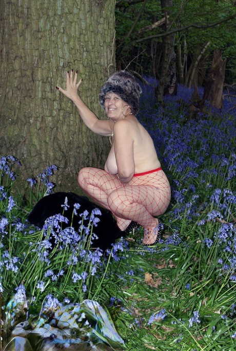 Mature lady removes her winter coat to show her big naturals in mesh pantyhose