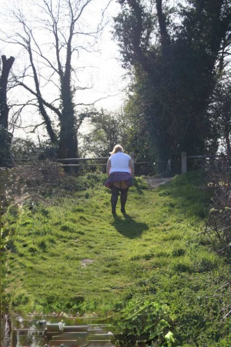 Overweight blonde Lexie Cummings exposes herself by locks on a canal system