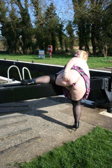 Overweight blonde Lexie Cummings exposes herself by locks on a canal system