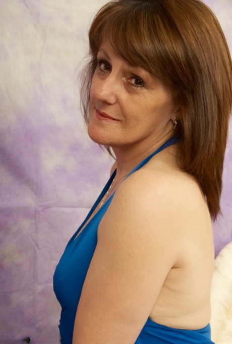 Slender hot granny Pandora bares small tits & asshole & poses on her knees