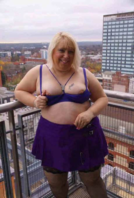Older British BBW Lexie Cummings exposes her fat ass and twat on a balcony