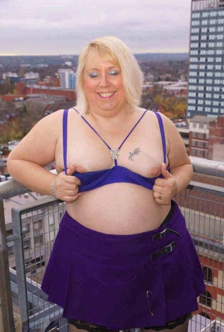 Older British BBW Lexie Cummings exposes her fat ass and twat on a balcony