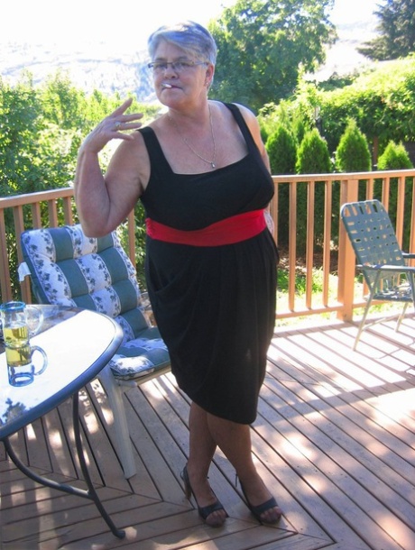 Amateur grandmother Girdle Goddess smokes before getting naked in nylons