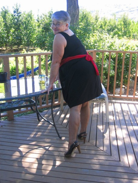 Amateur grandmother Girdle Goddess smokes before getting naked in nylons