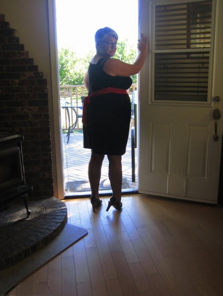 Amateur grandmother Girdle Goddess smokes before getting naked in nylons
