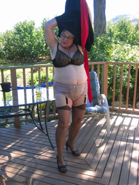 Amateur grandmother Girdle Goddess smokes before getting naked in nylons