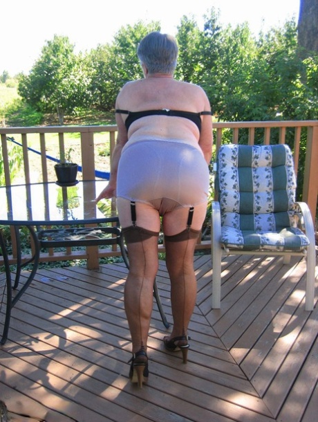 Amateur grandmother Girdle Goddess smokes before getting naked in nylons