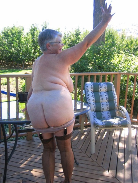 Amateur grandmother Girdle Goddess smokes before getting naked in nylons
