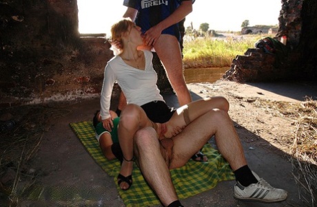 Caucasian chick does anal while having sex with two strangers on blanket