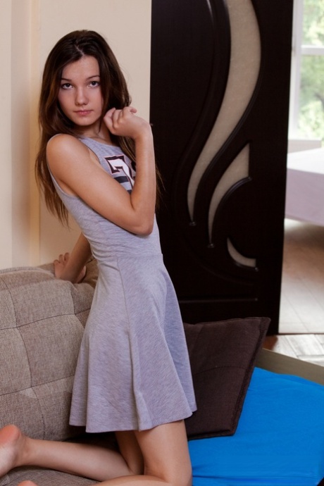 Slim teen Rogned bares her tight ass and pussy during nude modelling debut