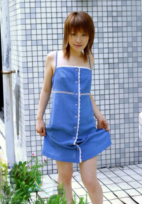 Young Japanese girl Akari shyly puts her hairy muff on display