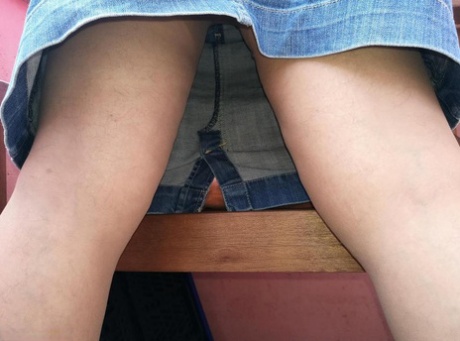 Horny oma spreads her upskirt pussy after pulling down her hose on patio