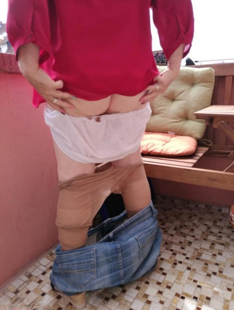 Horny oma spreads her upskirt pussy after pulling down her hose on patio
