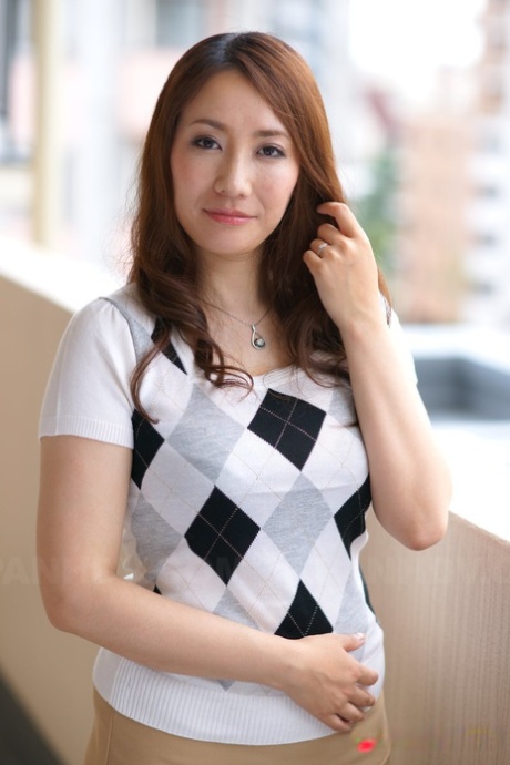 Japanese redhead Akari Niiyama showcases her shaved vagina in sheer nylons
