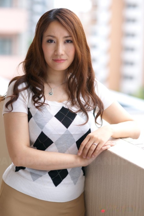 Japanese redhead Akari Niiyama showcases her shaved vagina in sheer nylons