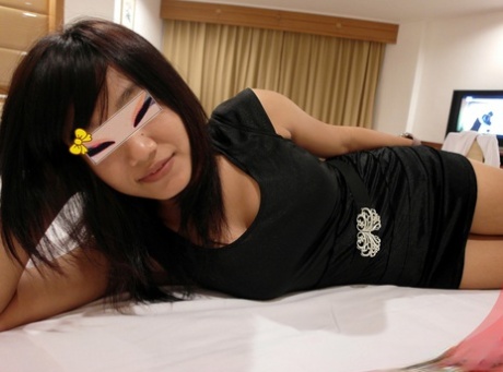 Young Thai girl Apple removes a little black dress before fucking a foreigner