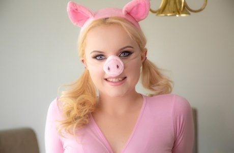 Blonde girl River Fox strips naked attired in a Miss Piggy costume