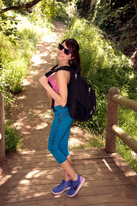 Young girl Andi Land exposes herself during a hiking expedition