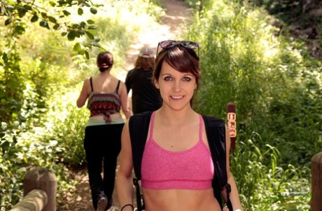Young girl Andi Land exposes herself during a hiking expedition