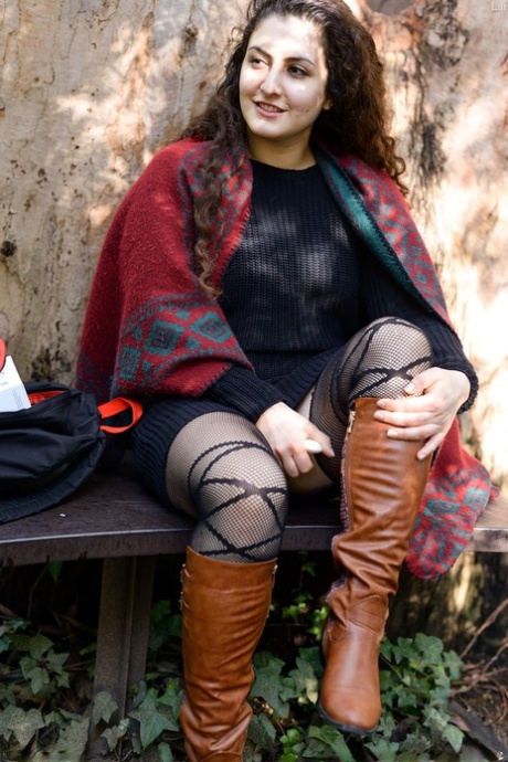 Thick amateur sports the upskirt look while modeling lingerie and boots