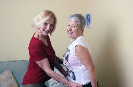 Old lesbians suck on each others boobs after modeling fully clothed