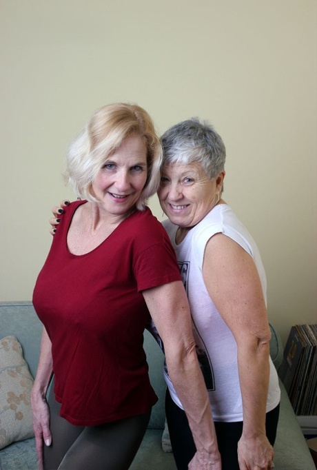 Old lesbians suck on each others boobs after modeling fully clothed